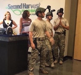 Lobby, 3 members of the SWAT team with helmets stand by the dining room door