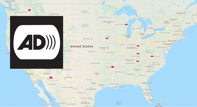 United States map with nine red dots on different places. The audio description symbol appears on the left, over the map. It is formed by the letters "AD" and three arches to the right of the D.