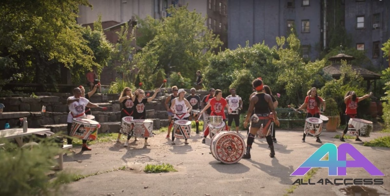 a group of dancers in a park