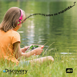 Girl with headphones listens video on a tablet. A descriptive phrase comes out of the headphones