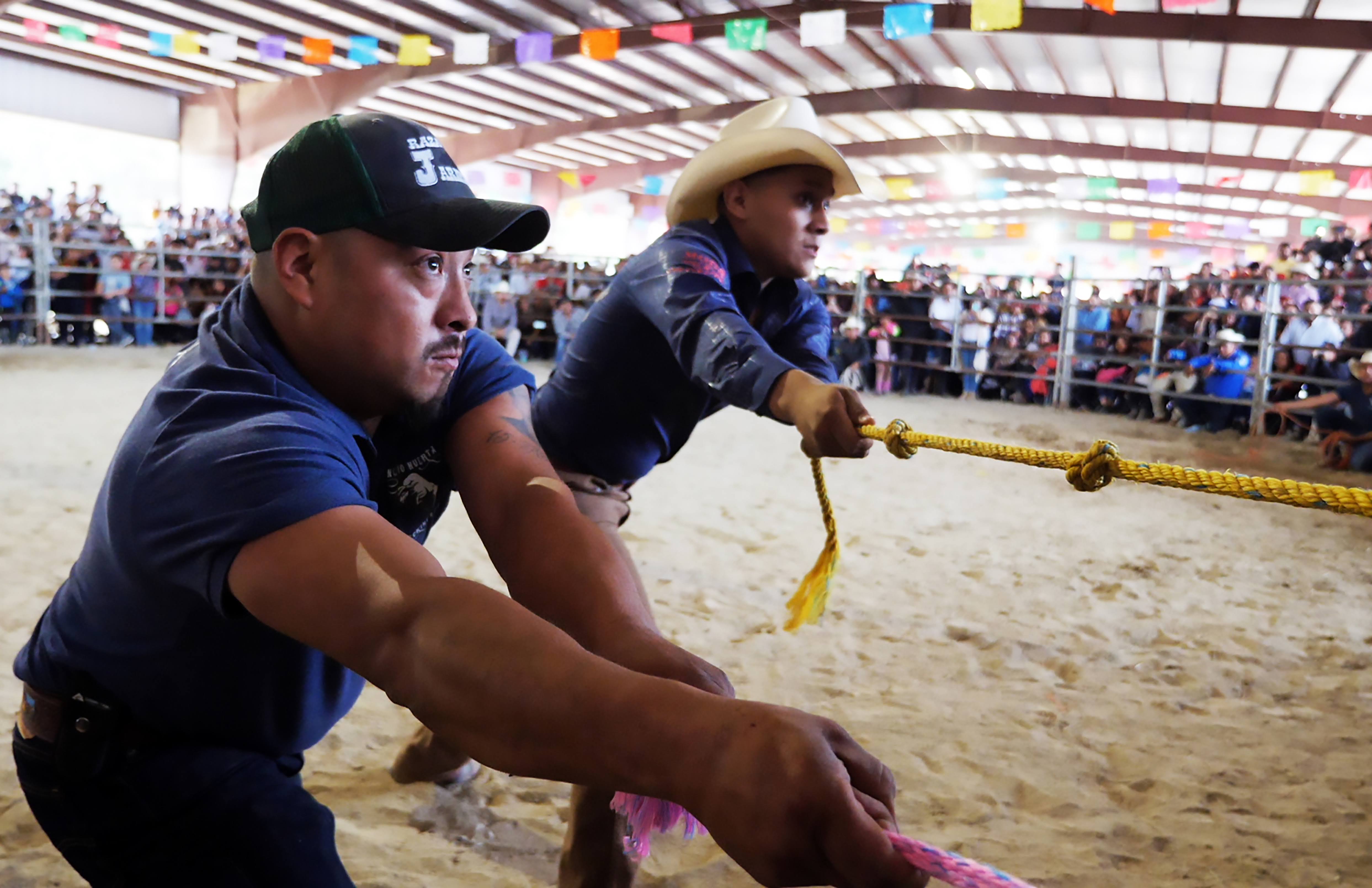 two men pulling a rope