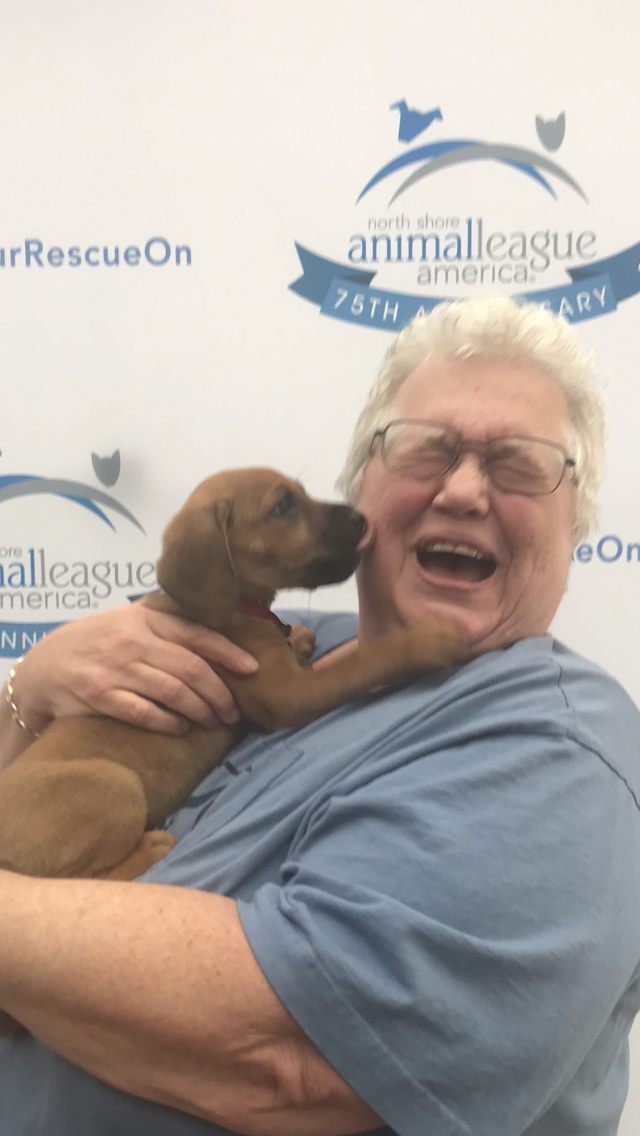 Jacki with a small puppy