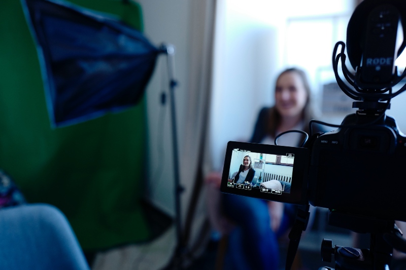 a woman being filmed