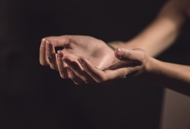two hands extended facing up